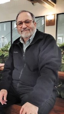 Official portrait of the Mayor, seated, at ease, aware of the camera's obligations